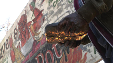 In Kevin's hands, the two halves of the demon tablet merge together. In Kevin's hands, the two halves of the demon tablet merge together.